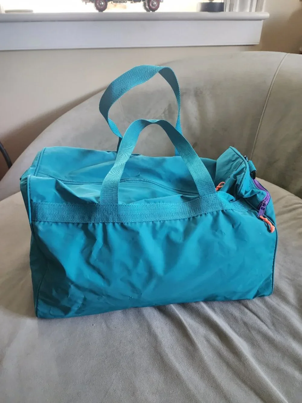 Vintage style Dunlop sports duffel bag in retro teal and purple color